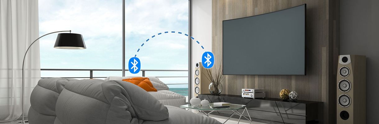 Two devices in a living room, connected via Bluetooth 5.4