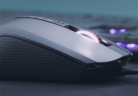 Close up of mouse on a black mousemat with RGB LEDs turned on
