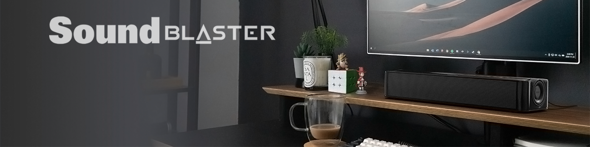 Lifestyle image of the speaker on a television stand