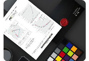 Image of BenQ AQColor pre-calibration report and colour charts on a desk
