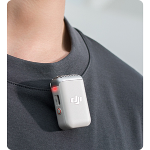 man wearing white DJI Mic 2 on black round necked collar tee shirt
