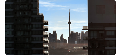 image of Shanghai Skyline from between two tall buildings and with clear blue sky
