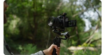 Vlogger using Lumix mirrorless camera and DJI Mic 2 to capture audio