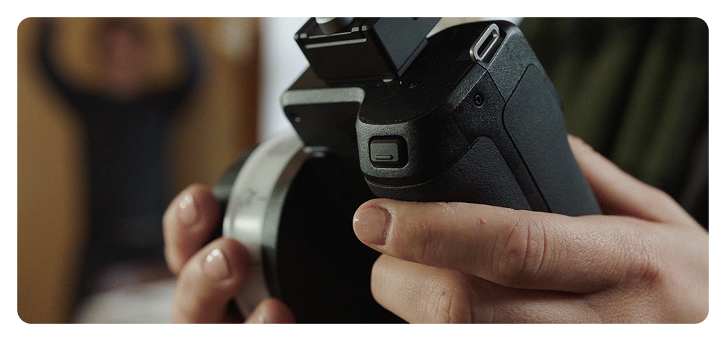 someone making adjustments using the dji focus pro hand unit