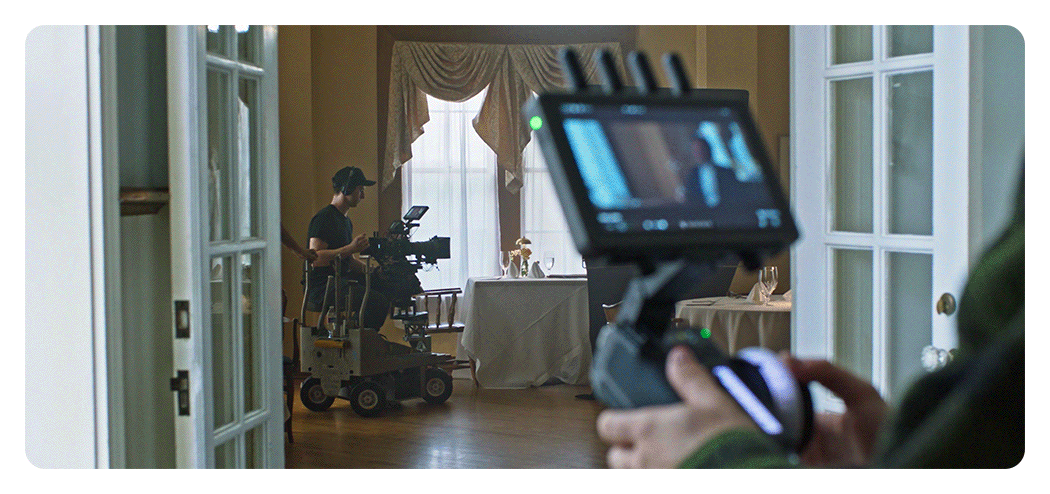 someone making adjustments using the dji focus pro hand unit at distance