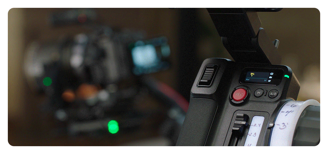 someone starting a recording using the dji focus pro hand unit