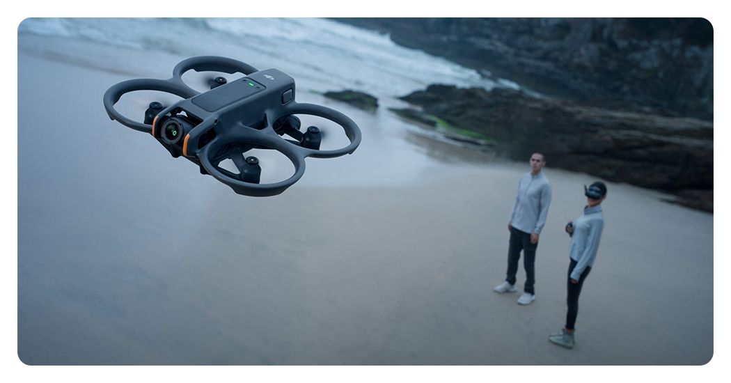 someone flying a drone using the dji goggles 3 on a beach