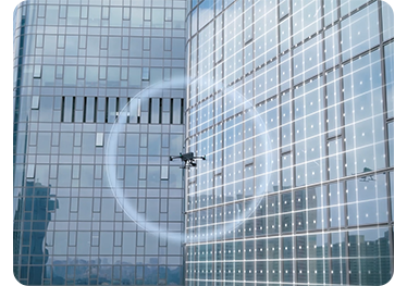DJI Matrice 400 drone hovering infront of tall office building