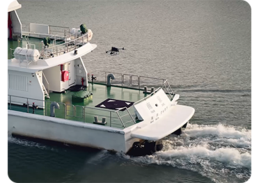 DJI Matrice 400 landing on rear deck of moving ship