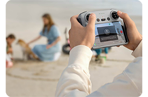 close up of someone using the dji mini 3 controller