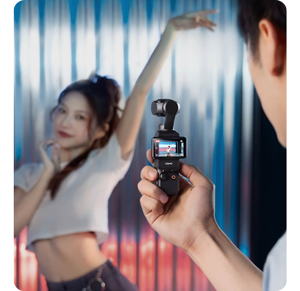 man filming female dancer with DJI osmo pocket 3