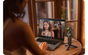 DJI Osmo Pocket 3 being used as a webcam for an virtual meeting in a coffee shop