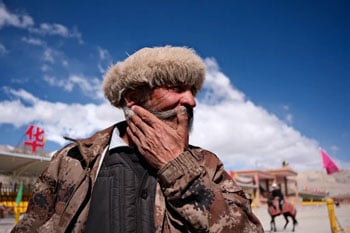 Portrait photograph of man wearing fur hat with clarity effect on Fujifilm X-E5