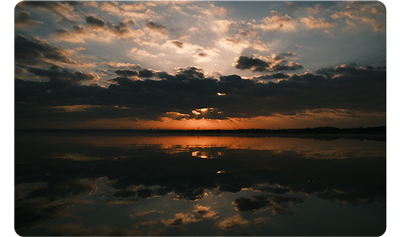 X100VI sample image of cloudy sunset image over water reflections