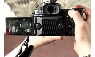 Fujifilm X-H2S with cooling fan being used to capture video footage