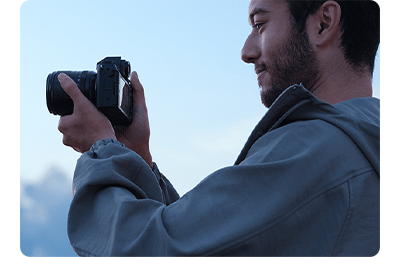 a person capturing a shot outdoors using the fujifilm x s20