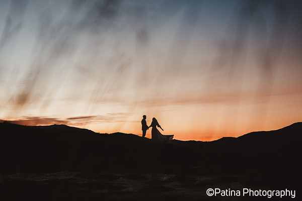 Fujifilm XT5 Classic Chrome Film Simulation sample image of a couple silhouetted against a orange sunset