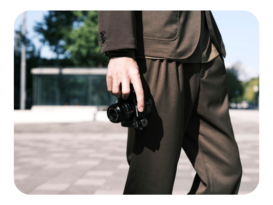 fujifilm xt5 being held in a photographers hand down at their side