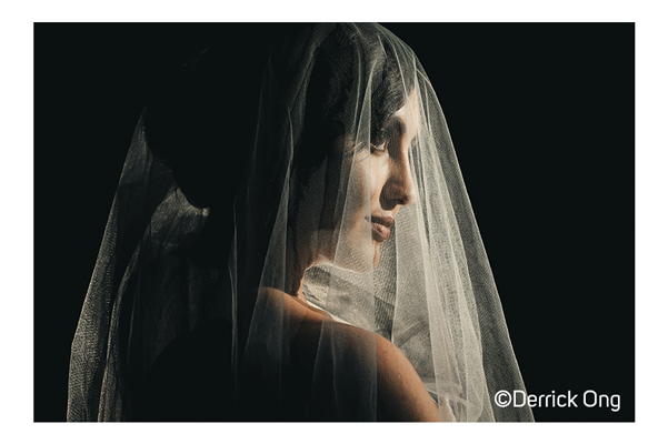Fujifilm X-T5 Sample photo of a woman wearing a wedding vail on a black background