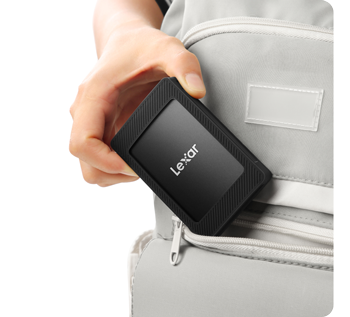 person pulling Lexar SL500M out of backpack zipper pocket