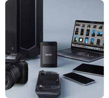 photograph of lexar sl500m ssd sat between macbook pro, iphones, mirrorless camera, steam deck and gaming PC