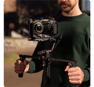 filmmaker with Lumix GH7 on DJI ronin gimbal recording footage