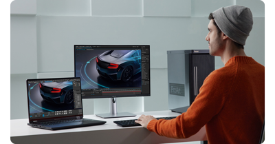 asus proart pa279cv monitor connected to a laptop on a grey desk