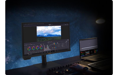 PA24US with a colour grading software window on display against a light blue background wall