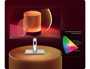 asus proart pa279cv monitor on a podium with colour gamut chart next to it
