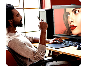 Photographer editing images of model on ASUS ProArt PA32DC 32 inch Profesional Monitor