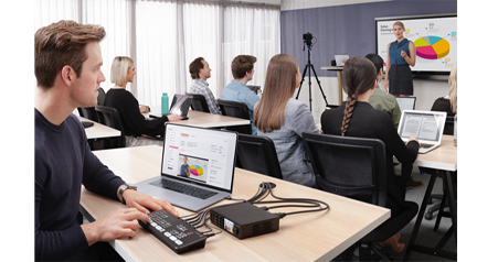 someone using the atem mini extreme in education