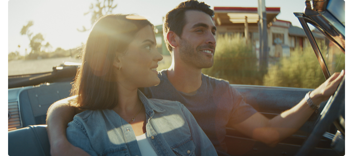 Man and woman sat in a convertible classic car, blackmagic cinema camera 6k
