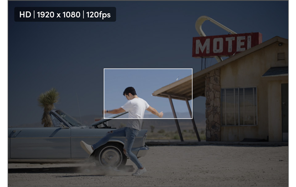 HD 1080P 16:9 still of a man kicking dust in front of a car in a motel parking lot