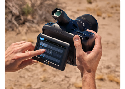 Blackmagic cinema camera 6k with operator using the touch screen