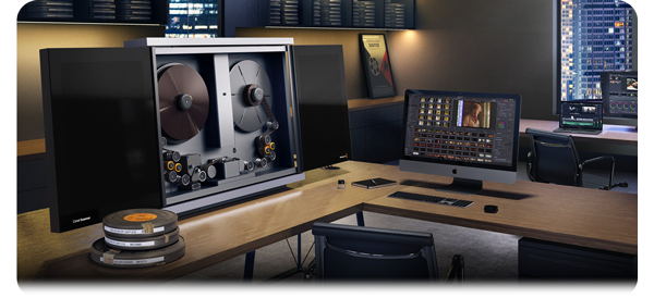 Blackmagic Cintel G3 HDR Scanner standing on wooden desk paired with apple mac