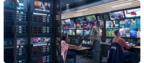 image of production team working in broadcast production truck surrounded by monitors and switchers