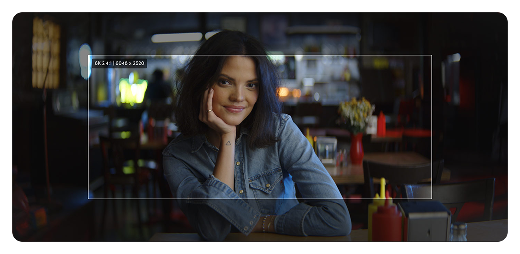sample image of a woman in a cafe showing blackmagic pyxis 12k format size