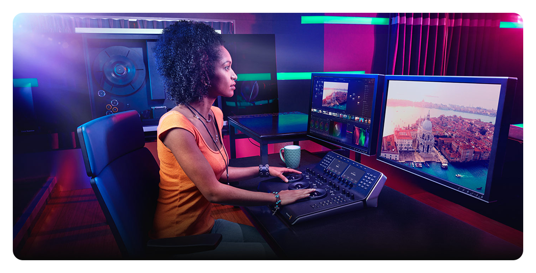 someone using davinci resolve studio at a desk in a studio