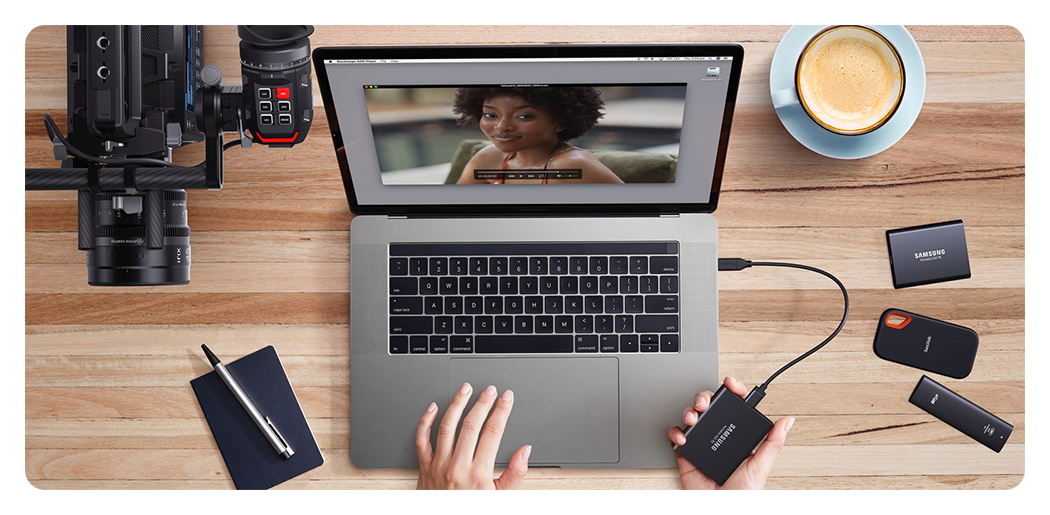 top down view of someone at a desk editing footage from the blackmagic pyxis 12k