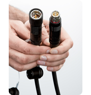 A person holding both ends of a SMPTE Hybrid Fiber Optic Cable