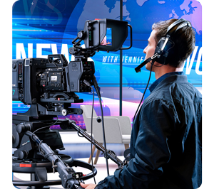 man operating ursa broadcast on a pedestal with external viewfinder and headset