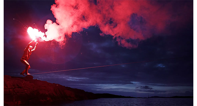 sample image of someone with a red flare at night taken on the canon r