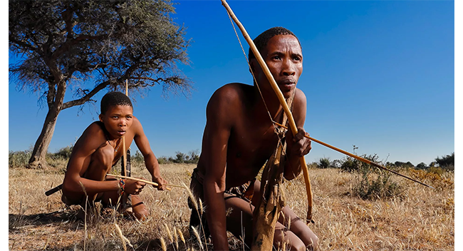 sample image of 2 people hunting in the wild taken on the canon r