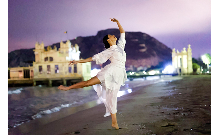 sample image of a woman dancing on a beach taken on the canon r6 camera