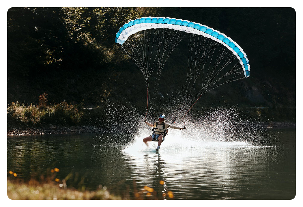 photo of a paraglider on a lake taken on the canon r6 mark ii camera