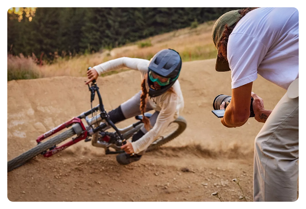 someone taking a photo of someone on a dirt bike with the canon r6 mark ii camera