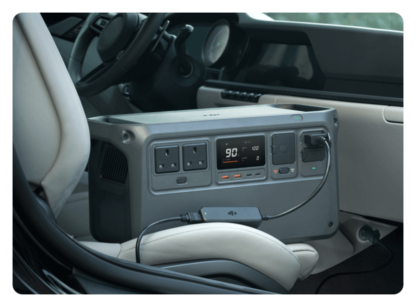 DJI portable power station being charged via a car