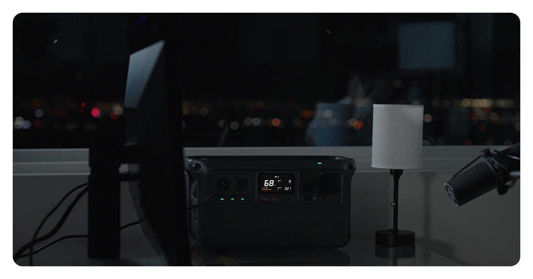 someone recording into a microphone next to the DJI portable power station