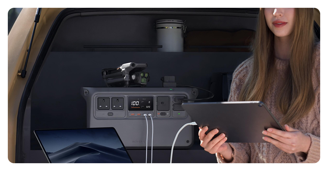 someone using the DJI portable power station to power an ipad