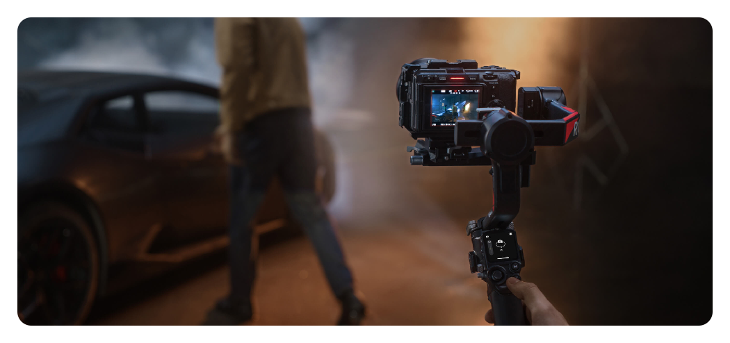 DJI RS 4 Pro being used to film a man near a car